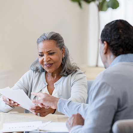 A woman and man review the latest fund updates.