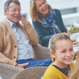 A couple enjoying time with their grandchildren, knowing they are protected with Protective Advantage Choice universal life insurance.