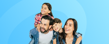 A smiling mother, father and their two children.