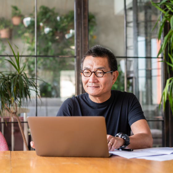 Person at computer exploring details of the Protective Secure Saver Pro fixed annuity.