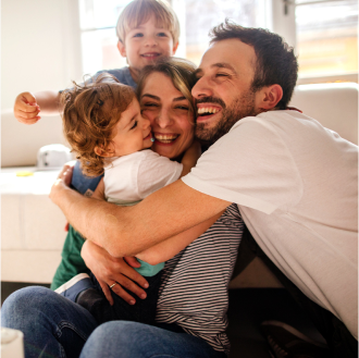 A young family embracing, knowing they are protected with Protective ProClassic Legacy UL.
