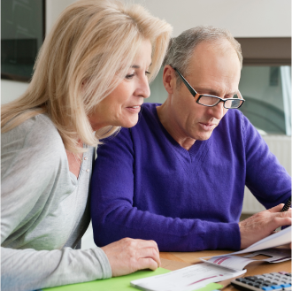 Man and woman reviewing details about their retirement plan." 