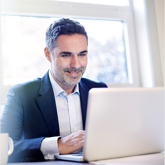 Financial professional at a computer, submitting business with Protective.