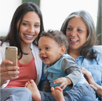 A grandmother, mother and child enjoying time together, knowing they are protected with life insurance from Protective