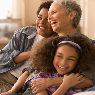 A woman spending time with her grandchildren and happy knowing her income is protected with Protective Income Creator fixed annuity.