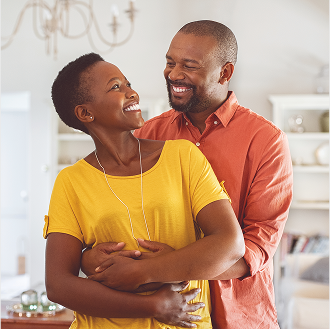 A couple embracing, happy that they know how to optimize their Social Security.