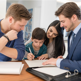 A financial professional helping a young family apply for life insurance.