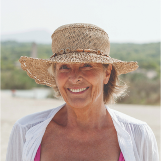 A woman on vacation is feeling more confident now that she has added protection to her life insurance plan.