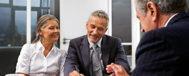 Financial professional discussing retirement income risks with clients.