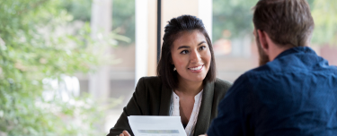financial professional discussing investment options available for a client's growth plan