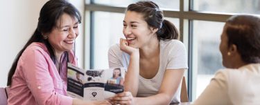 Financial representative expanding their business by meeting with a mother and daughter about legacy planning needs.