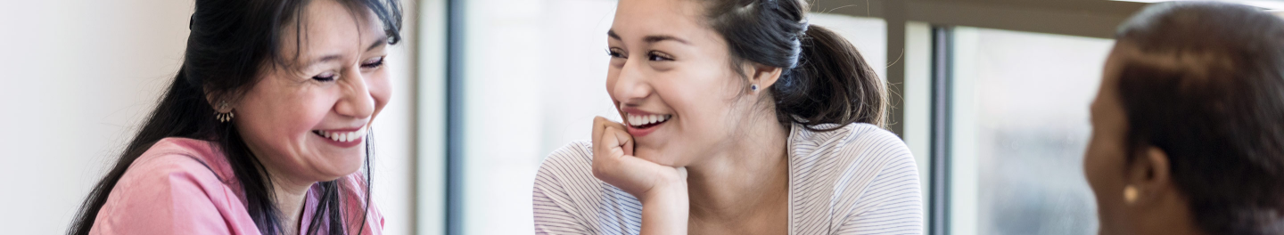 Financial representative expanding their business by meeting with a mother and daughter about legacy planning needs.