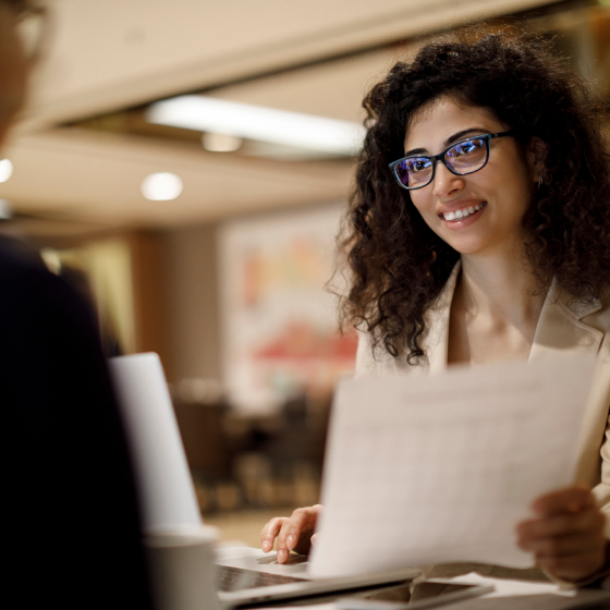 Financial professional discussing life insurance and protection solutions with a client