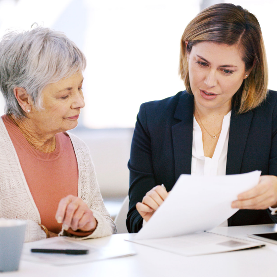 A financial professional explaining common Medicare myths to her client. 