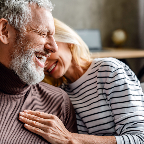Couple celebrating the fact that Social Security will help fund their retirement.